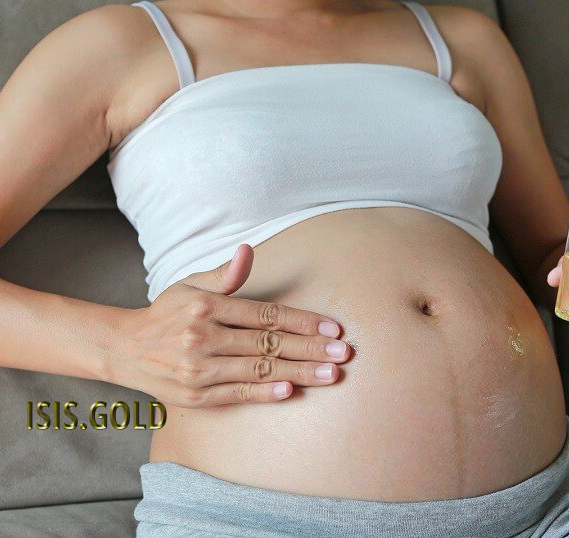 pregnant Caucasian woman rubbing oil cream on her belly, stretch marks before and after, how to get rid of stretch marks, stretch marks removal, stretch mark treatment